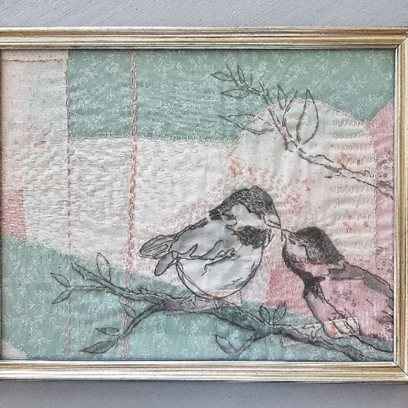 Chickadees in love. Hand-stitched composition made from personal fabrics for a wedding anniversary